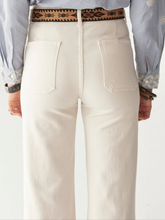 Load image into Gallery viewer, White pants with a patterned belt worn by a person on a white background